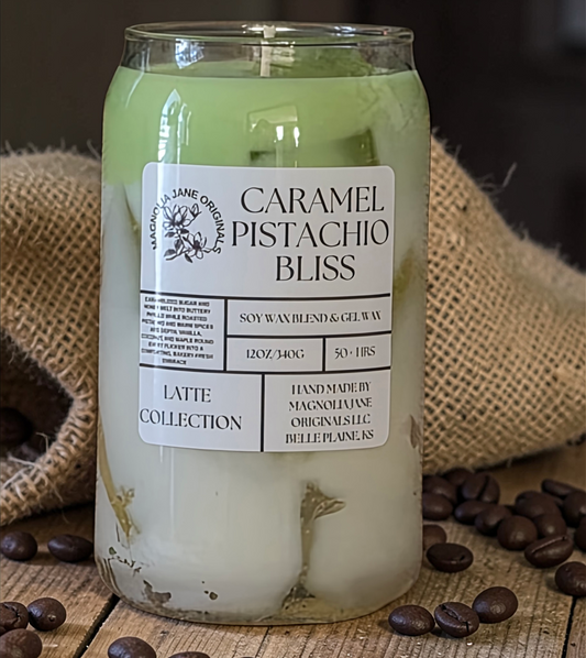 A tall glass with gel wax that appear to look like ice cubes.  The cubes glow when lit. The top third of the candle is a pale mint green and the bottom 2/3 is a creamy white with a blend where they meet.