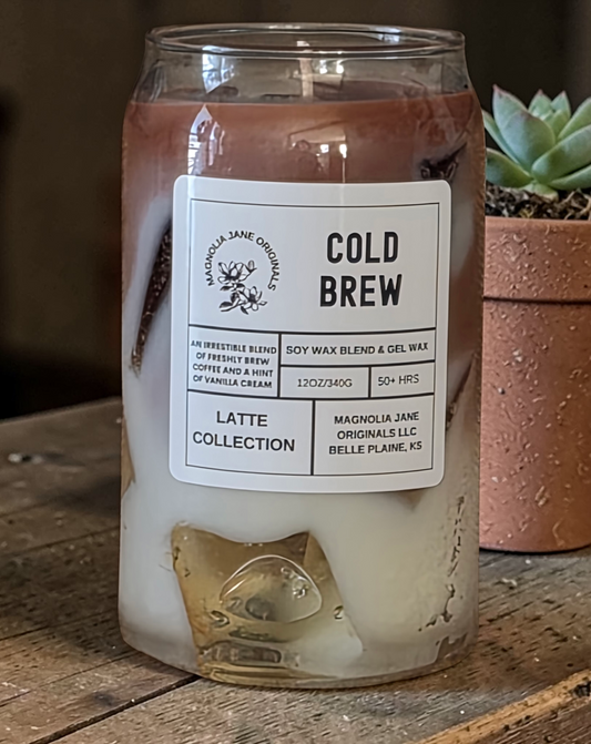 A tall glass with gel wax that appear to look like ice cubes.  The cubes glow when lit. The top third of the candle is a medium to dark brown and the bottom 2/3 is a creamy white with a blend where they meet.