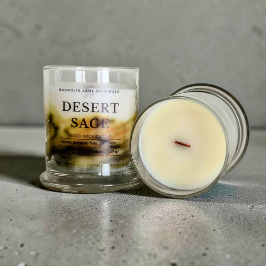 Desert Sage is a wooden wick candle that is a creamy white color with a swirl design on the lower half of the candle in tan & olive
