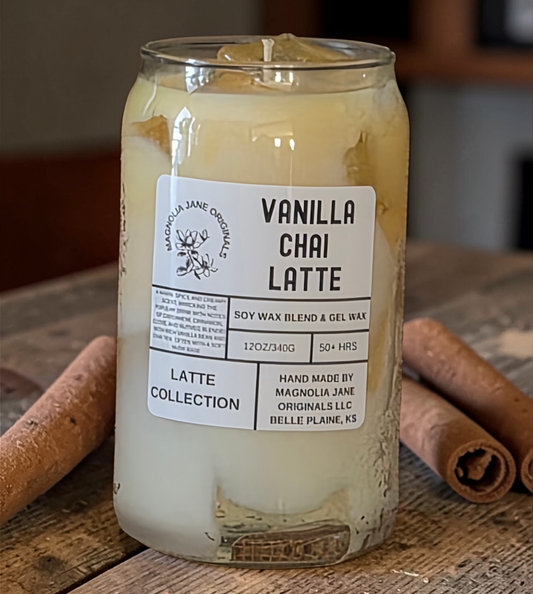 A tall glass with gel wax that appear to look like ice cubes.  The cubes glow when lit. The top third of the candle is a pale yellow cream color and the bottom 2/3 is a creamy white with a blend where they meet.